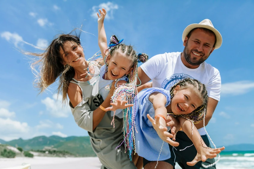 A happy family enjoying a sunny day at the beach