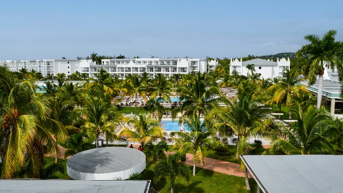 Tropical resort with palm trees and swimming pools