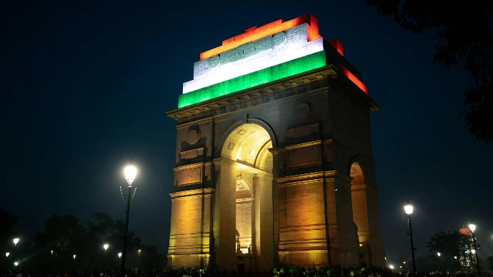 A large monument with a flag on top of it